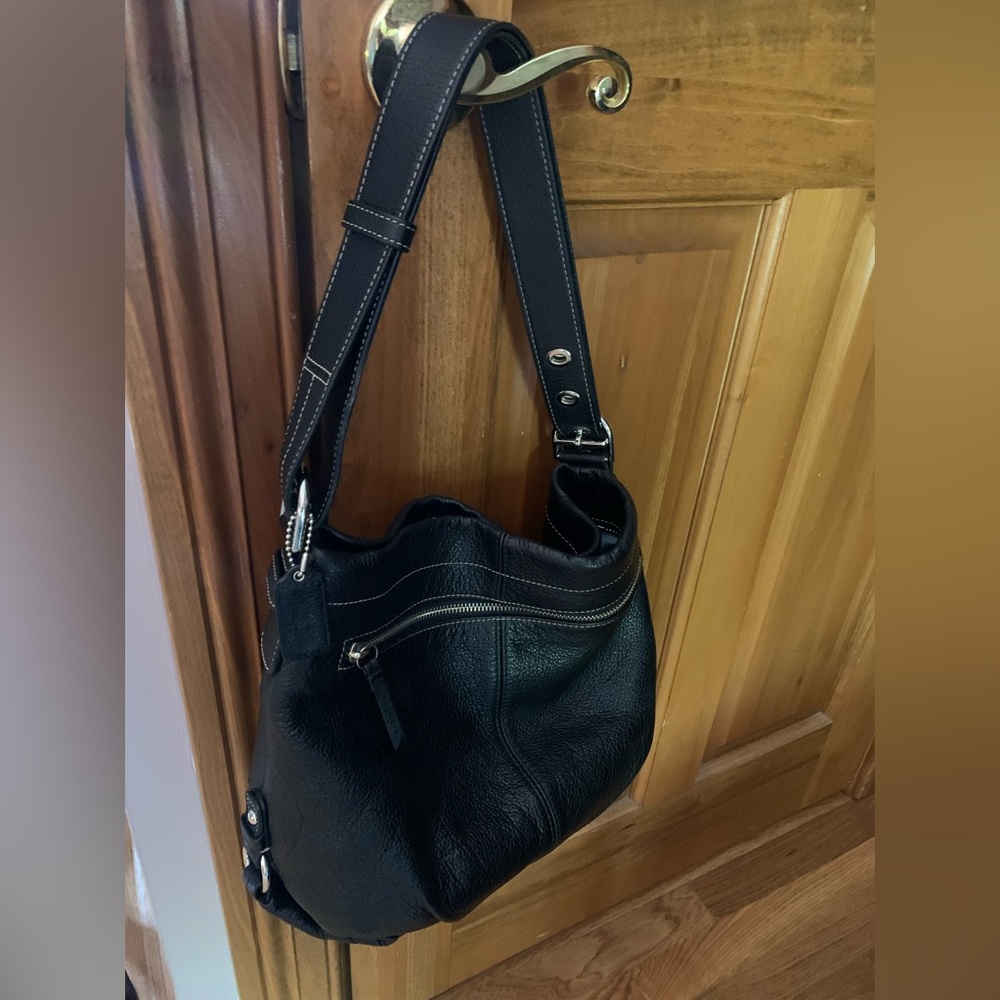 Coach duffel purse in black.  Used, like new - extremely clean no wear & tear.